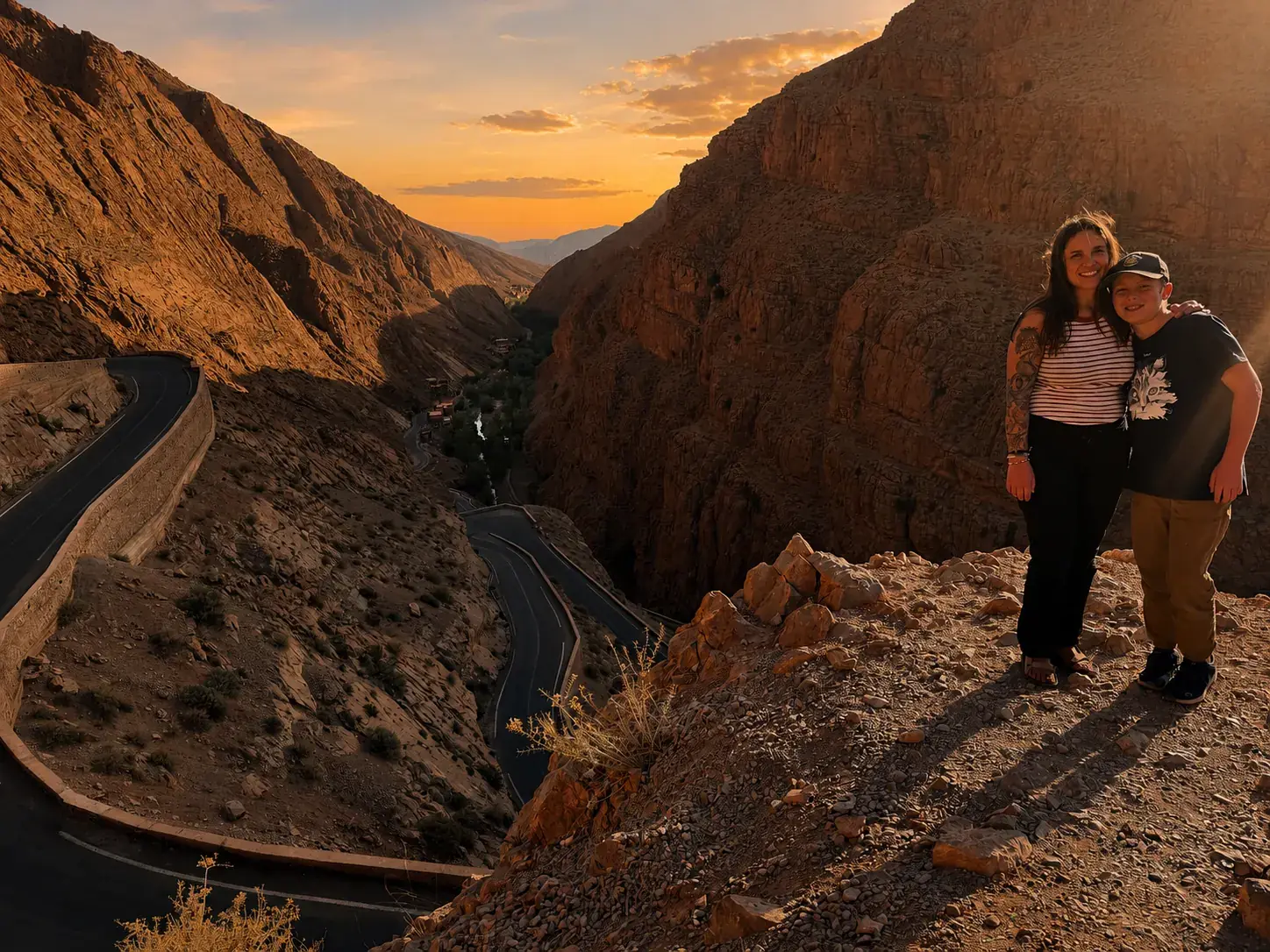 Travellers at the Dades Gorge viewpoint at sunset
