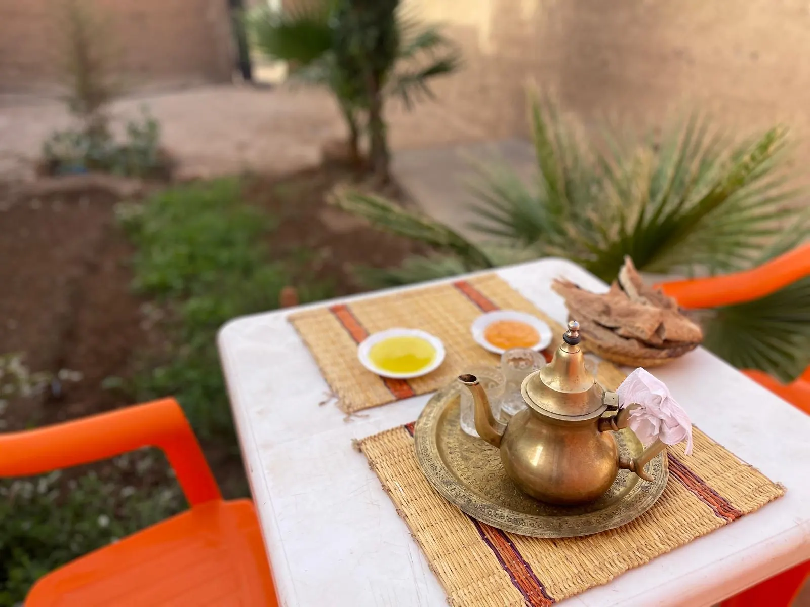 Moroccan mint tea served on a garden table in the Atlas foothills